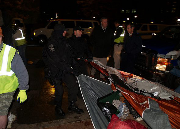 Ed Davis watches tents being dismantled