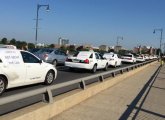 Taxi drivers protest Uber on the Massachusetts Avenue Bridge between Boston and Cambridge