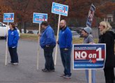 Human billboards outside Holy Name School in West Roxbury