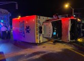 Ambulance on its side after crash