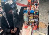 Surveillance photos of alleged suspect in black jacket and black cap