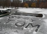 Message written in the ice in the Public Garden lagoon: Stay Tom