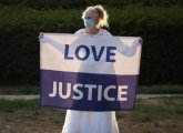 Woman with Love and Justice banner