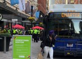 Bus bearing police officers in Downtown Crossing