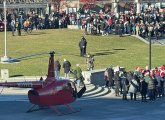 Santa getting off a helicopter in the North End