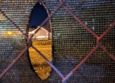 Hole in fence at dirt dump