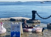 Man in kayak on Long Wharf in 2021