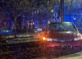 Car on Green Line tracks along Beacon Street