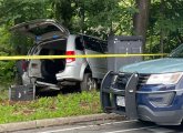 Crashed handicap-transport van on the side of the Riverway