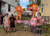 The DeMasi-Marx family on Tyndale Street with Home Depot giant skeletons dressed as DeathKings