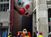 Giant head stuck in alley off Washington Street in Downtown Crossing