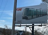 Sign advertising an Elmira Heights factory that will soon be making Green Line trolleys