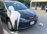 White paint on minivan on Lagrange Street next to Billings Field