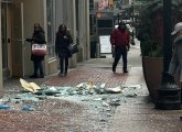 Smashed window bits lying on Washington Street