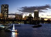 Sunset over the Charles River Lagoon and the Community Boating Christmas boat