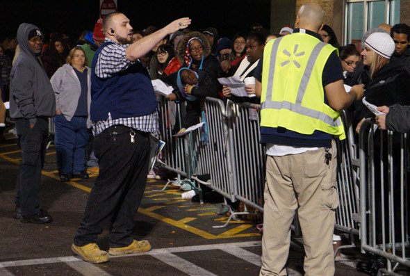 Guy giving out instructions at Walpole Wal-Mart