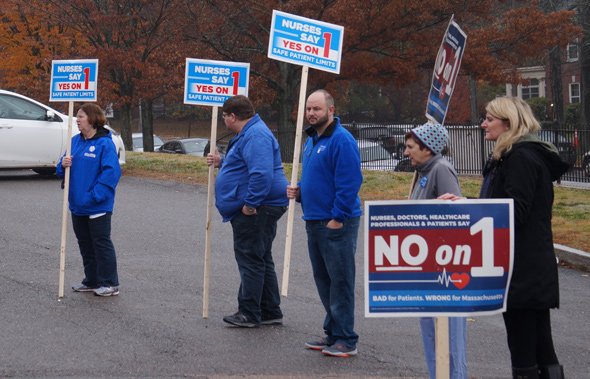 Human billboards outside Holy Name School in West Roxbury