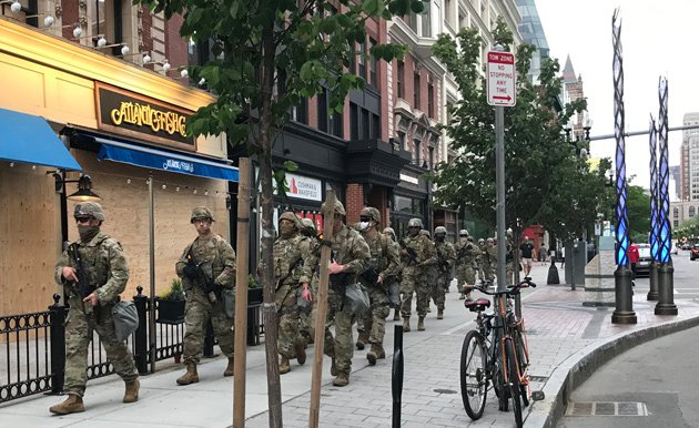 National Guardsmen march past Boston Marathon bombing memorial