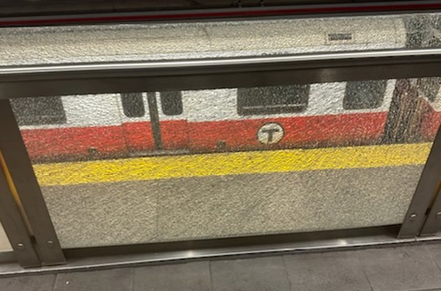 Smashed glass pane at Ashmont station