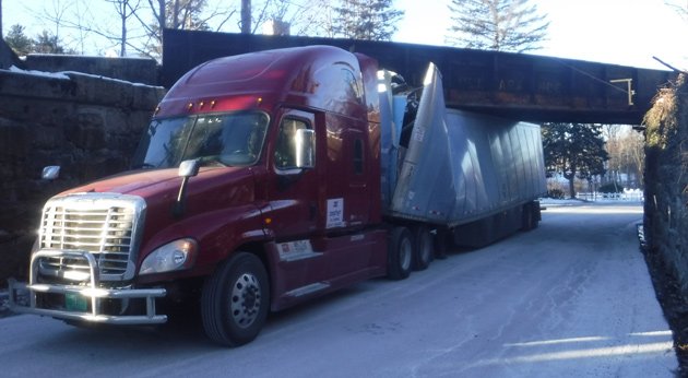 18-wheeler with some major trailer damage at Canton bridge