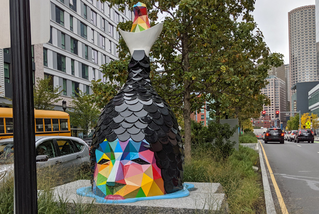 Giant-headed statue on Seaport Boulevard