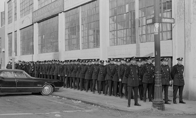 Boston cops with lots of buttons waiting for action